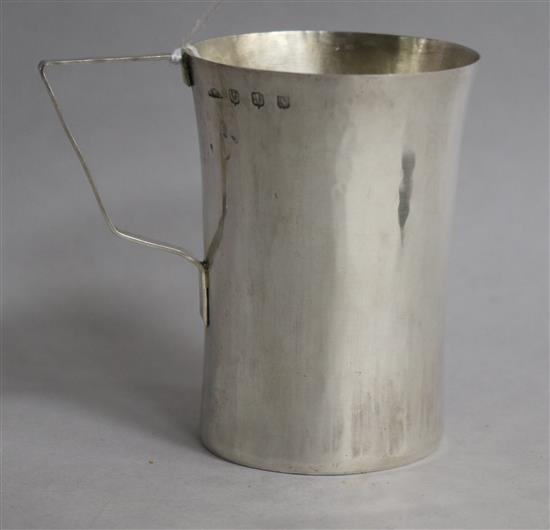 A stylish planished silver christening mug, A.W.J. Edinburgh, 1943, 84mm.